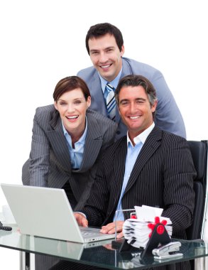 Merry business team working at a computer clipart