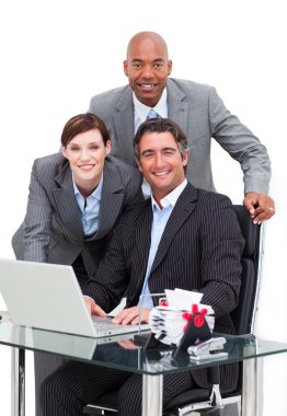 Self-assured business team working at a computer clipart