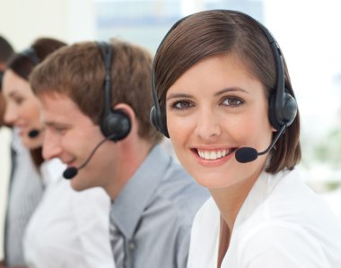 Female customer service agent in a call center clipart