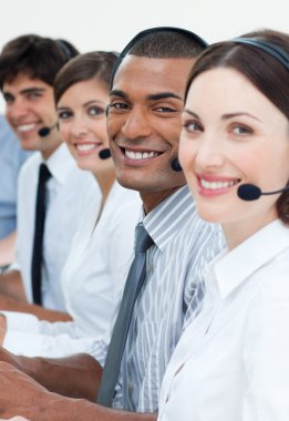 Customer service agents smiling at the camera clipart