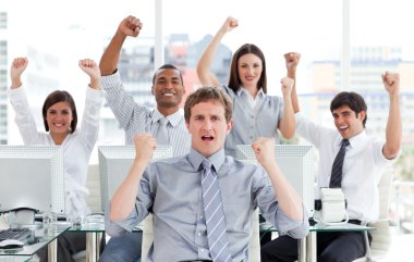 Enthusiastic business team celebrating success clipart