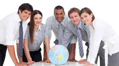 Portrait of business team around a terrestrial globe clipart