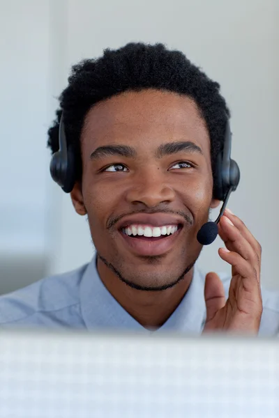 Afro-American businessman in a call center — Stock Photo, Image