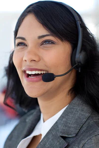 Smiling businesswoman in a call center — Stok fotoğraf