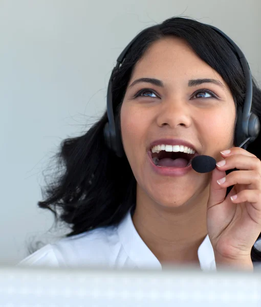 Beautiful businesswoman talking in a call center — Stok fotoğraf