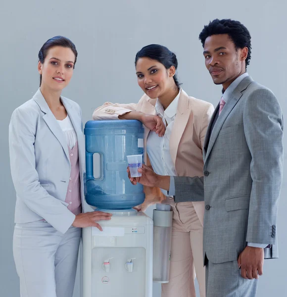 Business with a water cooler in office — Stock Photo, Image
