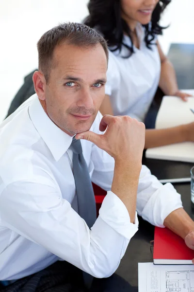 Businessman in a meeting looking at the camera — Stock Photo, Image