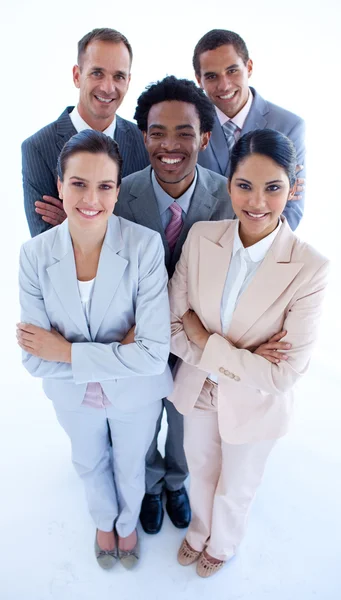 Happy international business team smiling at the camera — Stock Photo, Image