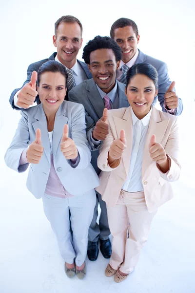 Feliz equipo de negocios multiétnicos con pulgares arriba — Foto de Stock