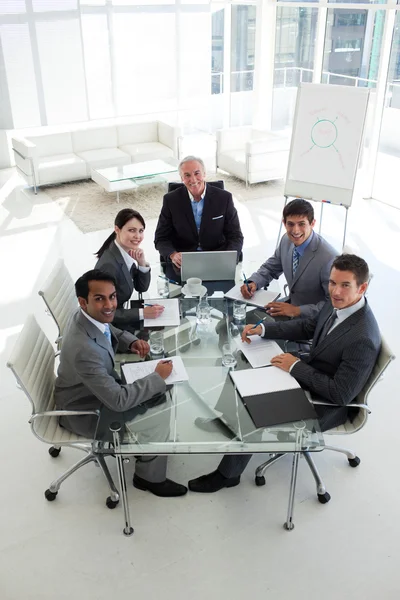 High angle of a business team smiling at the camera — Stock Photo, Image