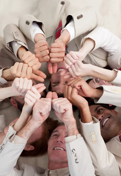 stock image Multi-ethnic business with thumbs up lying on the floor