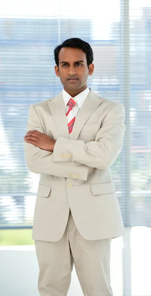 Stock image Confident ethnic businessman with folded arms