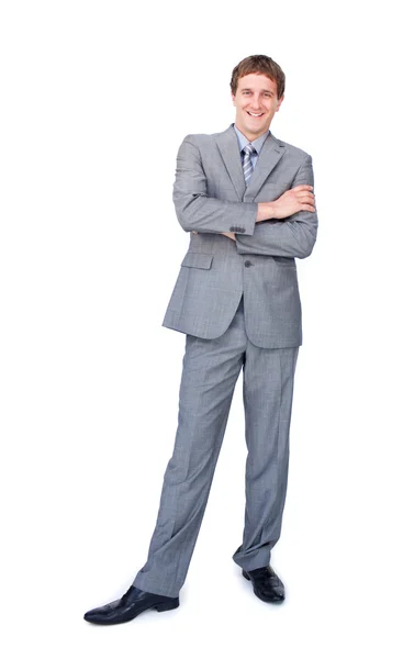 Uomo d'affari entusiasta in piedi con le braccia incrociate — Foto Stock
