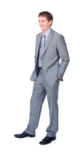 Young businessman standing with hands in pockets — Stock Photo, Image