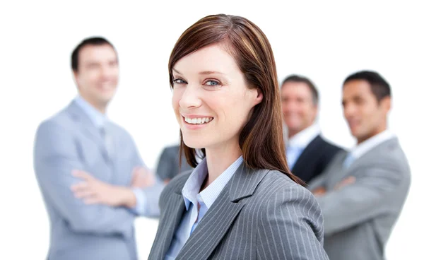Self-assured businesswoman standing with her team — Stock fotografie