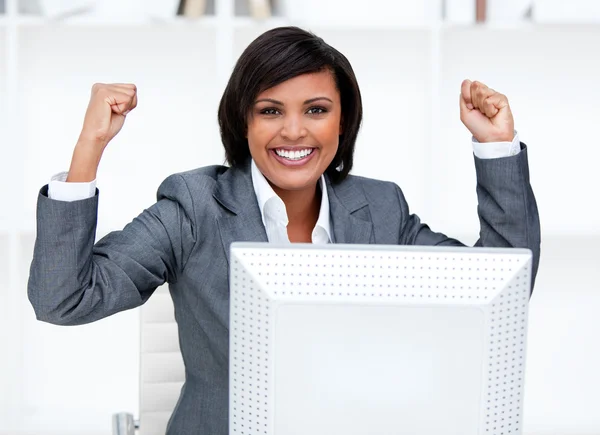 Confident businesswoman punching the air in celebration — Stock Photo, Image
