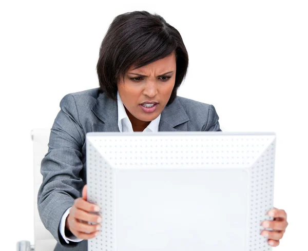 Frustrated businesswoman shaking her computer's screen — Stock Photo, Image