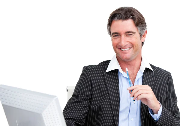 Cheerful businessman working at a computer — Stock Photo, Image