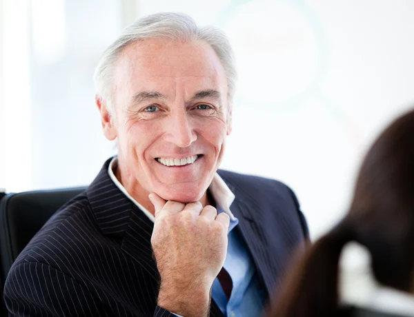 Charismatic senior businessman in a meeting — Stock Photo, Image