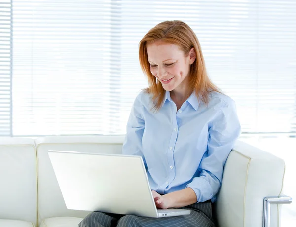 Cute business woman working on a laptop computer — Stock Photo, Image