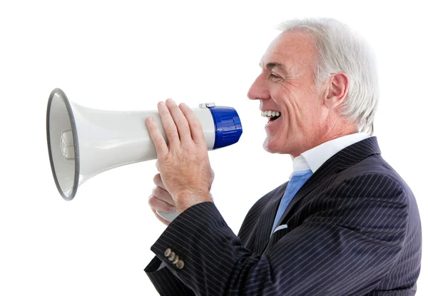 Starszy biznesmen uśmiechający się przy użyciu megafon — Zdjęcie stockowe