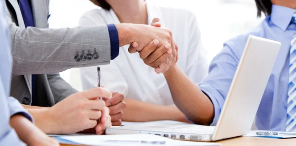 Close-up of business partners shaking hands — Stock Photo, Image