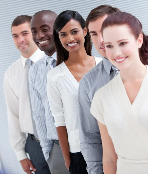 Cheerful multi-ethnic business partners standing in a line — Stock Photo, Image