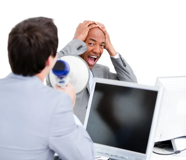 Stressed businessman yelling through a megaphone — Stock Photo, Image