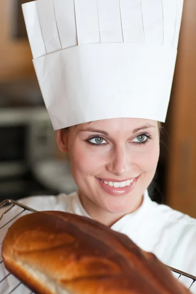 Confident female chef baking bread — Stock Photo, Image