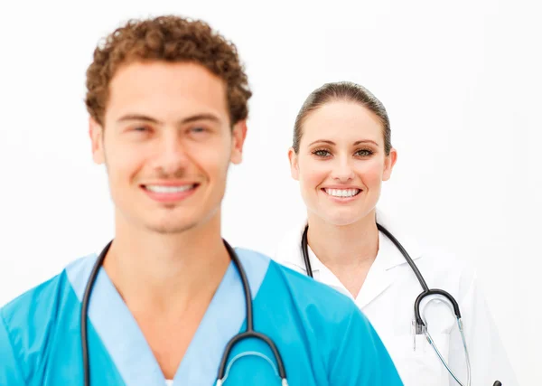 Portrait of two positive doctors against a white background — Stock Photo, Image
