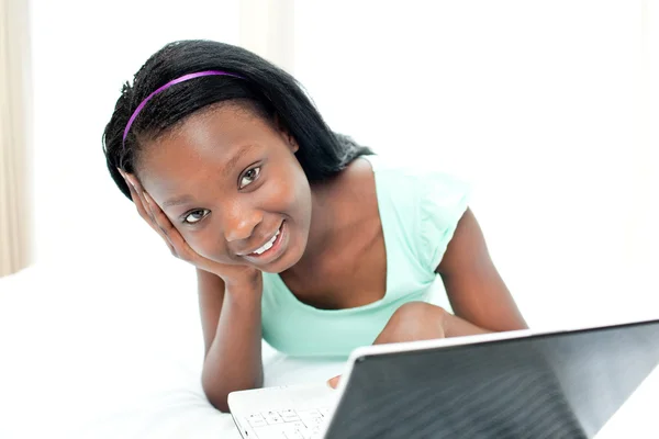 Jolly teen girl surfing the internet — Stock Photo, Image