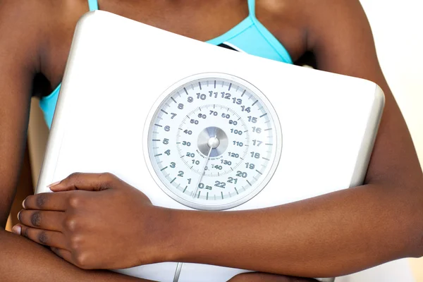 Close-up of a fitness woman with thumb up holding a weight scale — Stock Photo, Image
