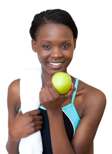 Αφρο-αμερικανικό γυμναστήριο γυναίκα τρώει ένα μήλο — Φωτογραφία Αρχείου