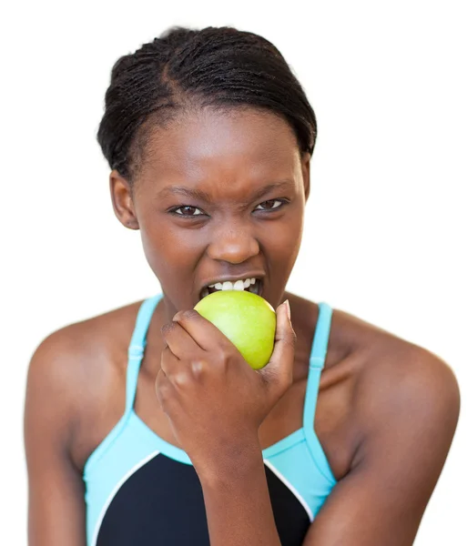 Cheerful fitness woman eating an apple — Stock Photo, Image