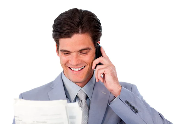 Empresário feliz no telefone segurando um jornal — Fotografia de Stock