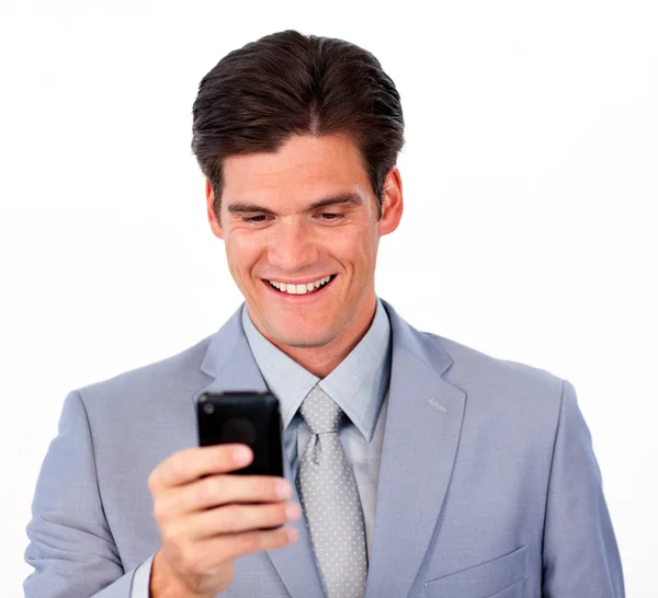 Cheerful businessman sending a message a newspaper — Stock Photo, Image