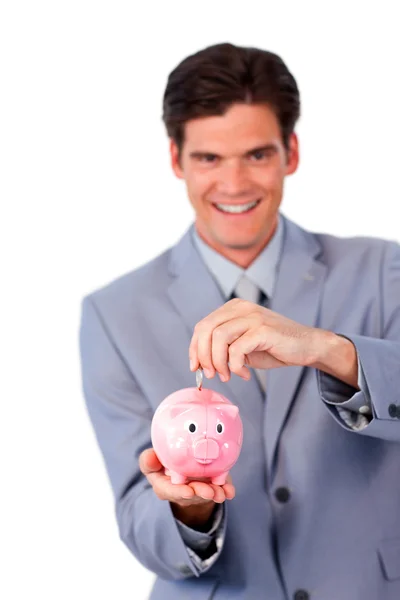 Alegre hombre de negocios ahorrando dinero en una alcancía — Foto de Stock