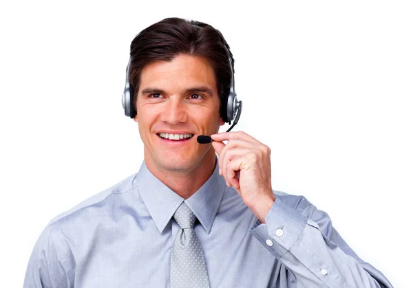 Positiva affärsman talar på headsetet — Stock fotografie