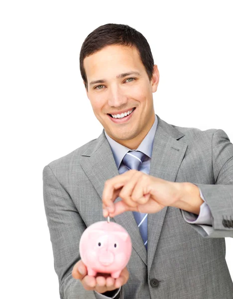 Selbstbewusster Geschäftsmann spart Geld in Sparschwein — Stockfoto