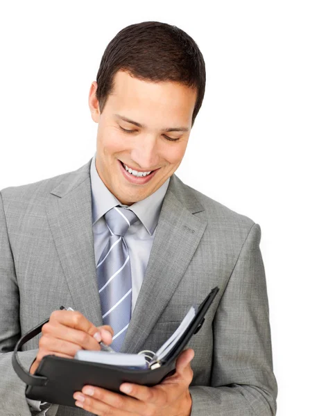 Confident businessman holding an agenda — Stock Photo, Image