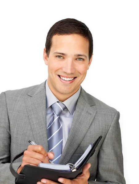 Uśmiechający się biznesmen posiadania programu — Zdjęcie stockowe