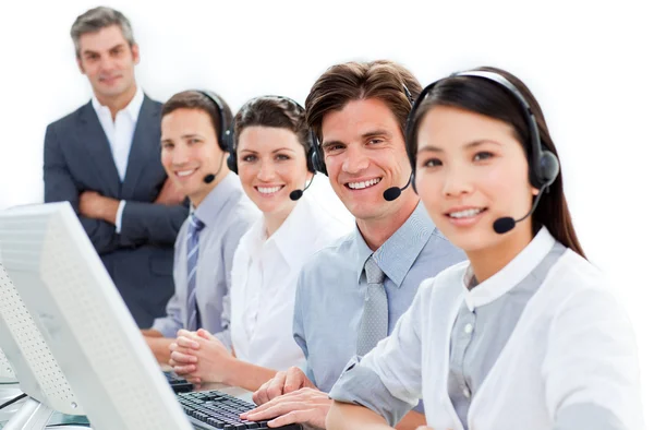 A diverse business team talking on headset — Stock Photo, Image