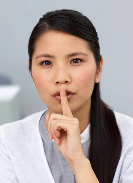 Charming businesswoman asking for silence — Stock Photo, Image