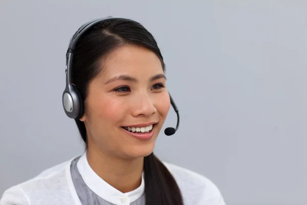 Charming young businesswoman with headset on — Stock Photo, Image
