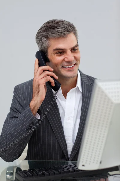 Positive male executive talking on phone — Stock Photo, Image