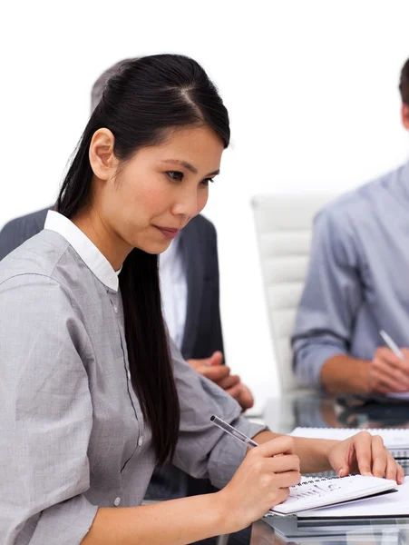 Concentrated female executive studying a document — Stock Photo, Image