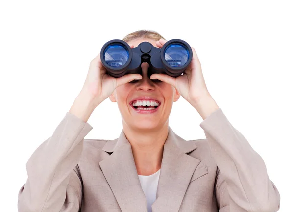 Joyful businesswoman predicting future success through binocular — Stock Photo, Image