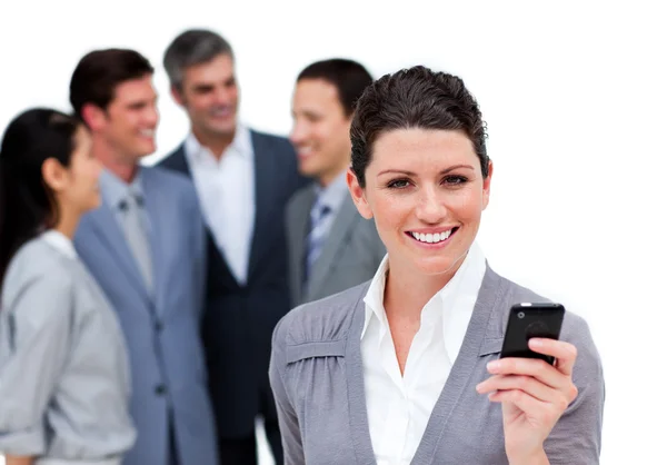 Charismatic manager on phone standig in front of his team — Stock Photo, Image