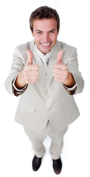 Victorious businessman with thumbs up — Stock Photo, Image