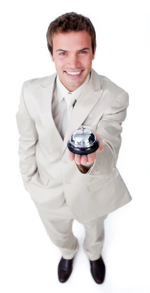 Joven empresario asertivo sosteniendo una campana de servicio — Foto de Stock